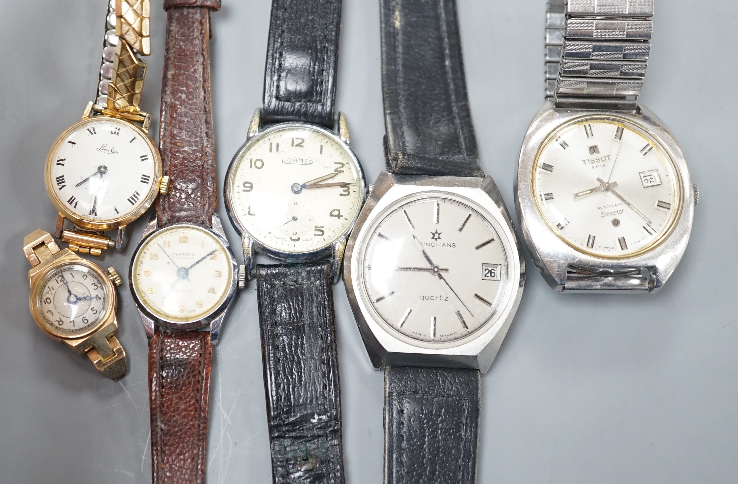 Three assorted gentleman's wrist watches including Junghans quartz, Roamer and Tissot and three lady's watches including Ingersoll and 9ct gold without strap.